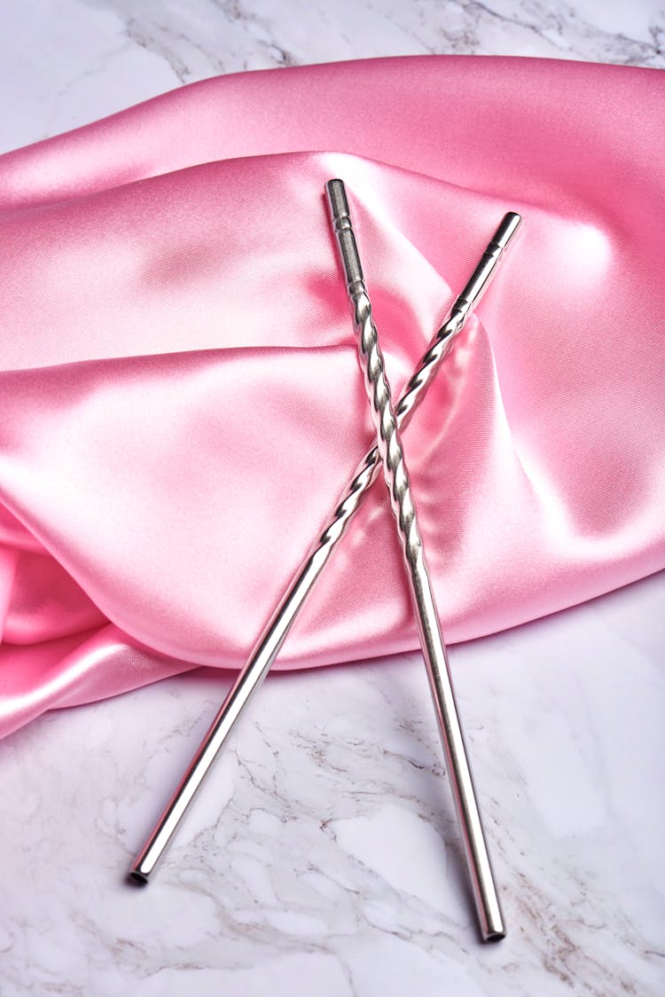 Metal Straw On Pink Silk