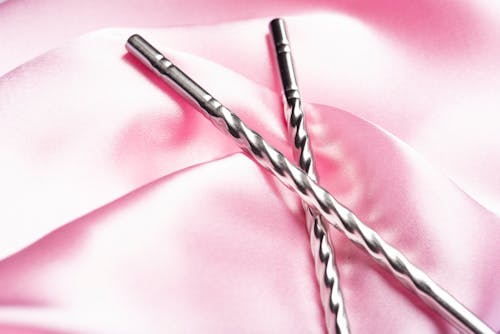 Silver Chopsticks on Pink Cloth