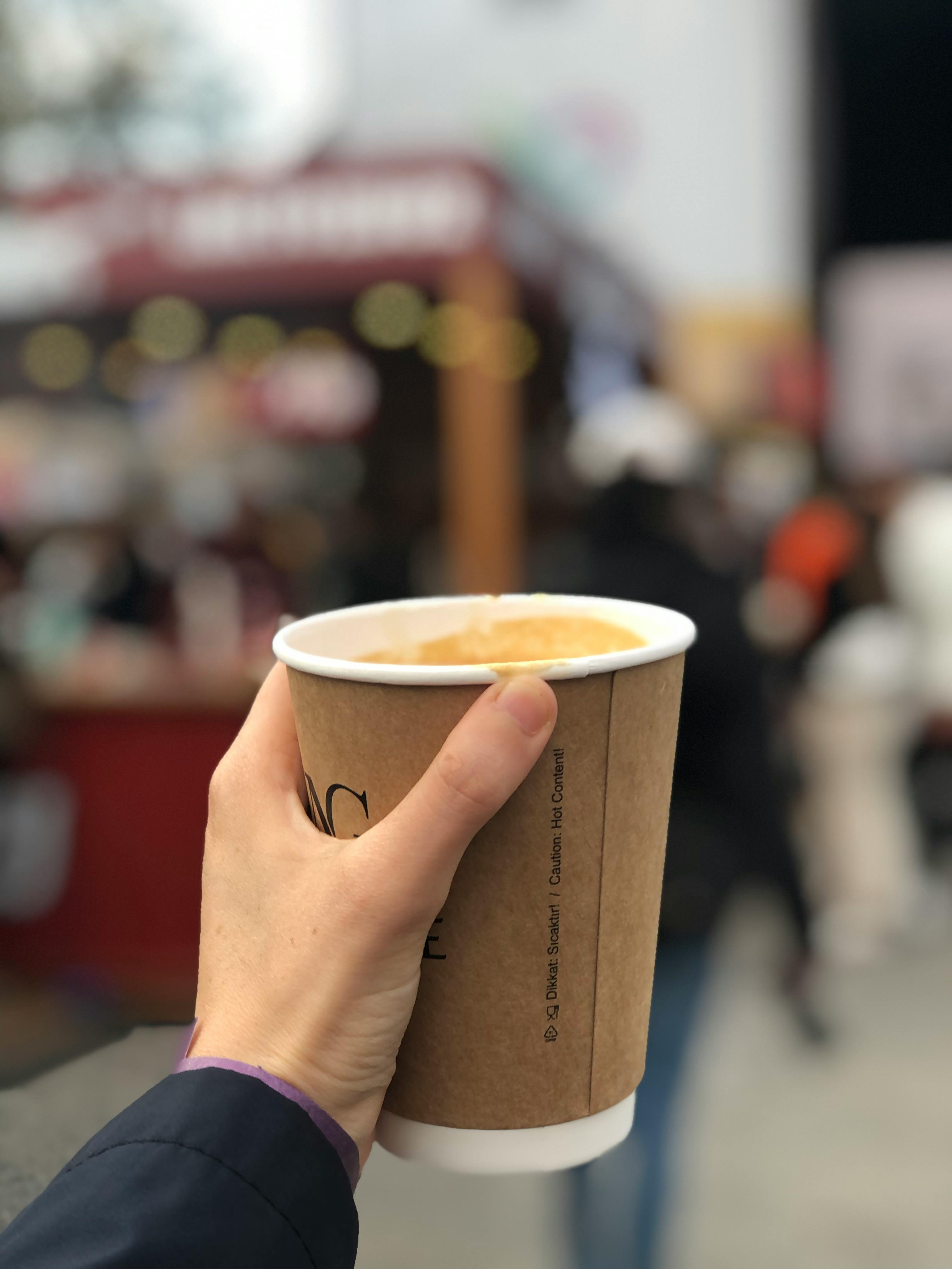 Person Holding a Paper Cup · Free Stock Photo