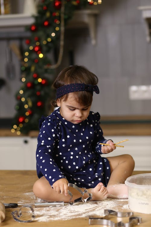 Cute Little Girl on Kitchen Counter