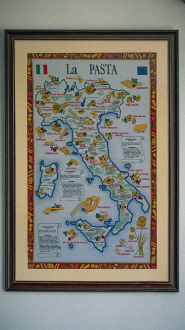 Illustrative map of Italy detailing regional pasta varieties in a framed poster.