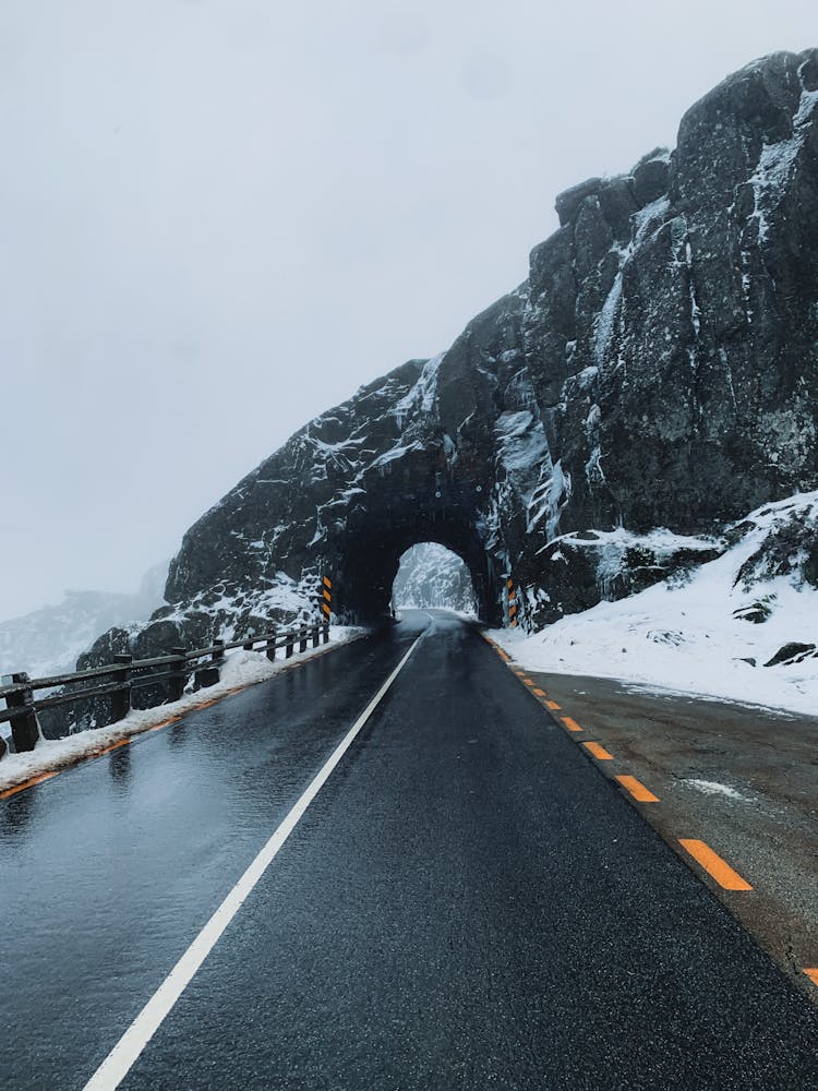 Road And Tunnel Through Rocks In Winter