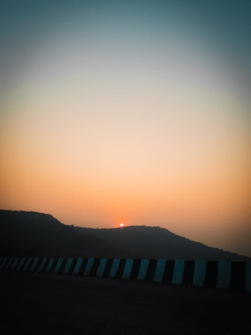 Sunset in Golden Sky over Landscape