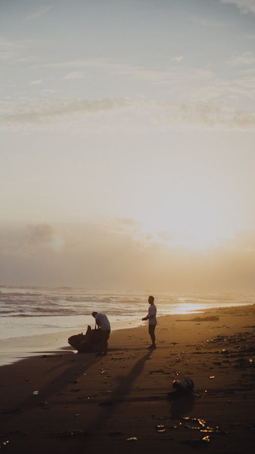 Men on Beach at Sunset
