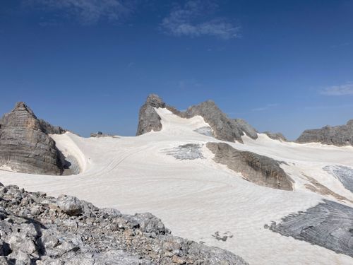 Free Pristine snowy mountains and glacier under clear blue sky, showcasing natural beauty and tranquility. Stock Photo