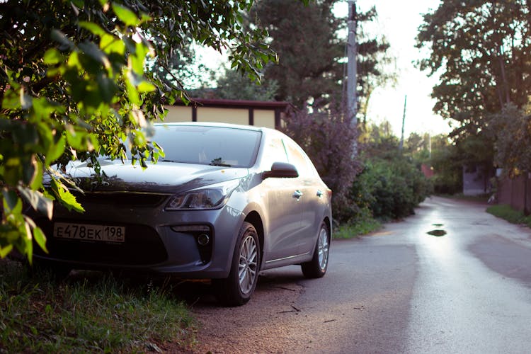 Car Standing On The Side Of A Village Road