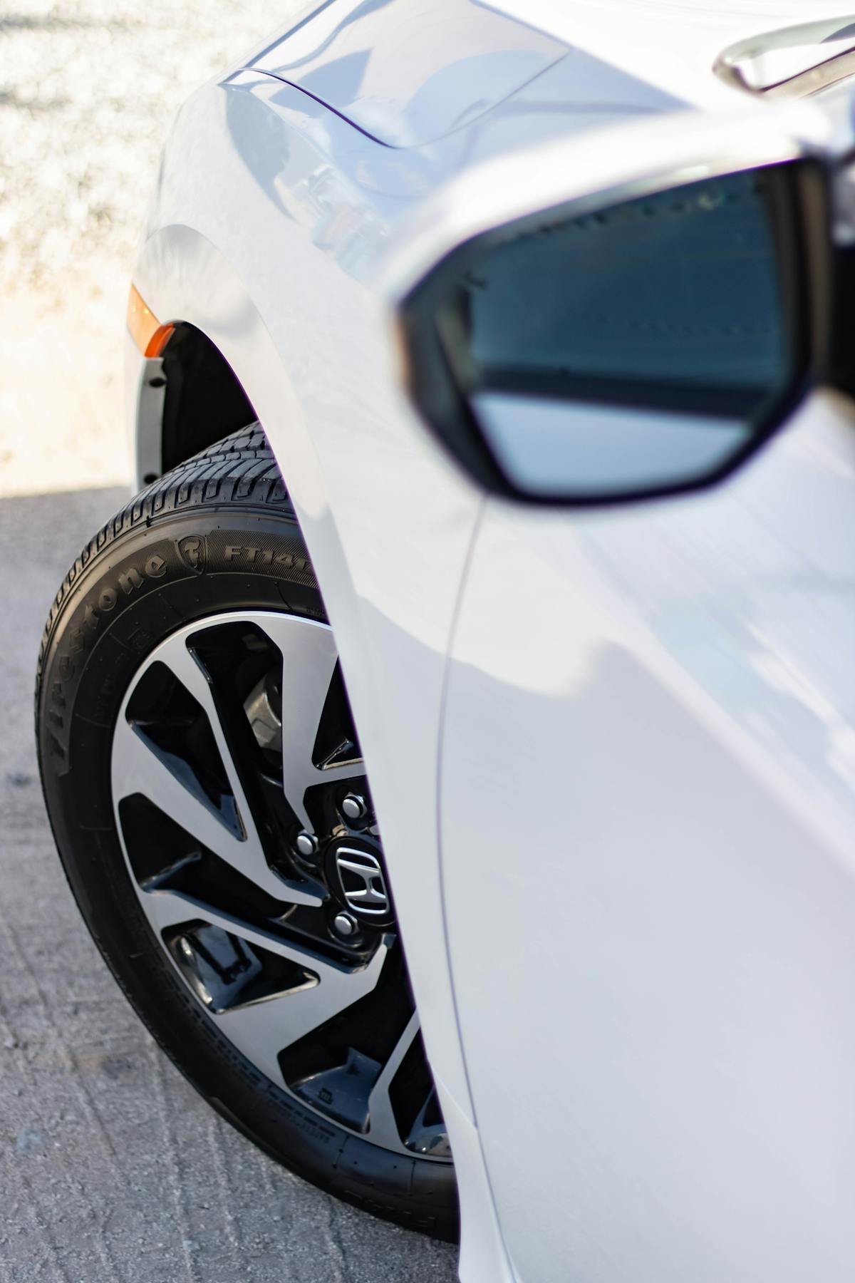 White Car With Gray 5 Lug Auto Rims · Free Stock Photo