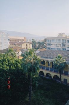 Aerial view of buildings and greenery in Hatay, Türkiye, showcasing its unique architecture.