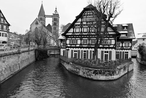 Free Charming black and white photo of a half-timbered house along the canal in Esslingen, Germany. Stock Photo