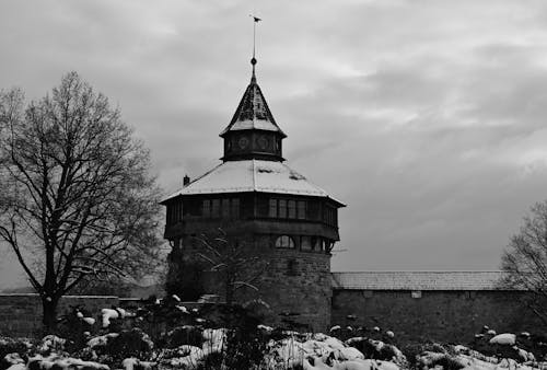 Black and White Photo of a Castle in Winter 
