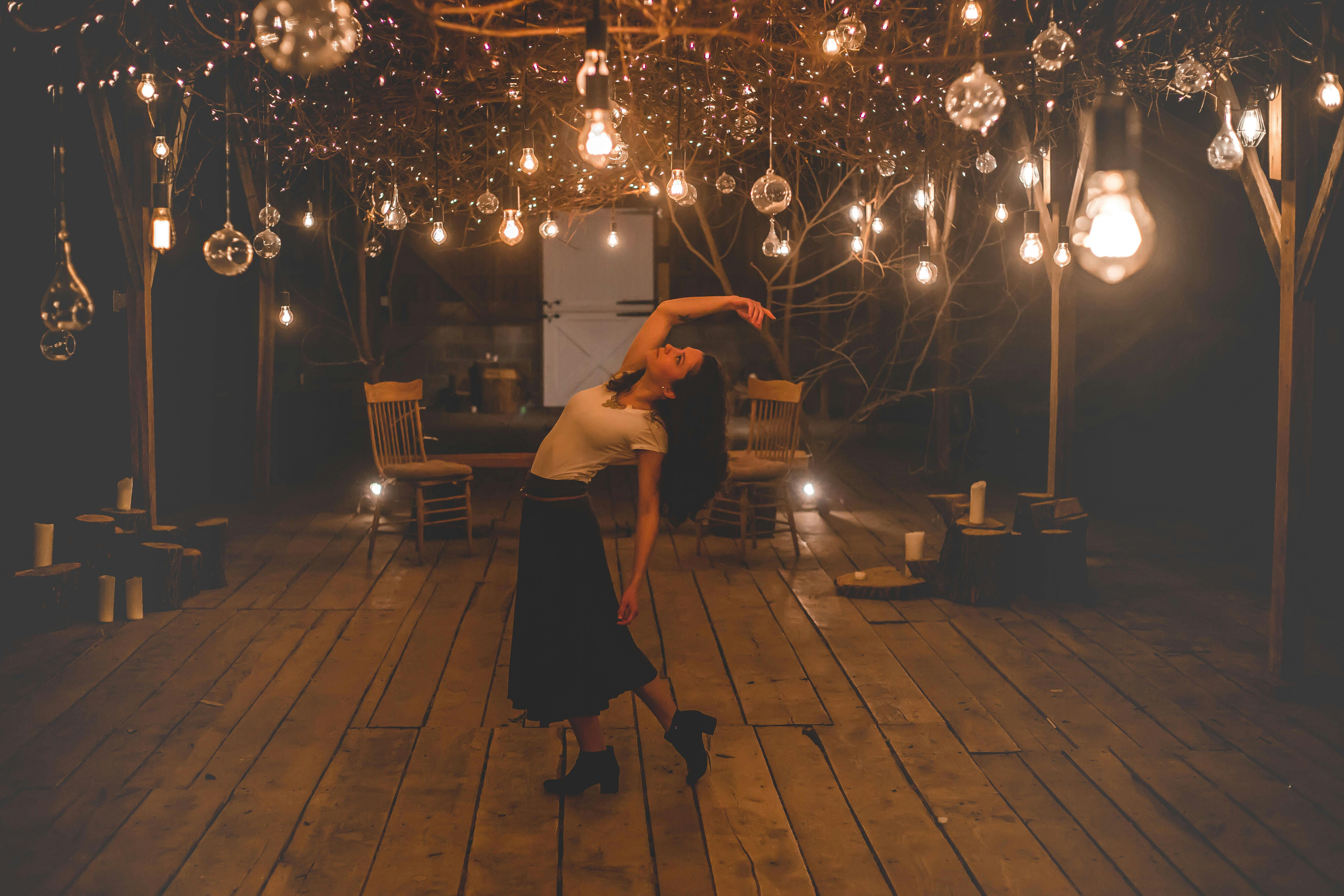Free Woman Dancing on Terrace With Lights Turned-on Stock Photo