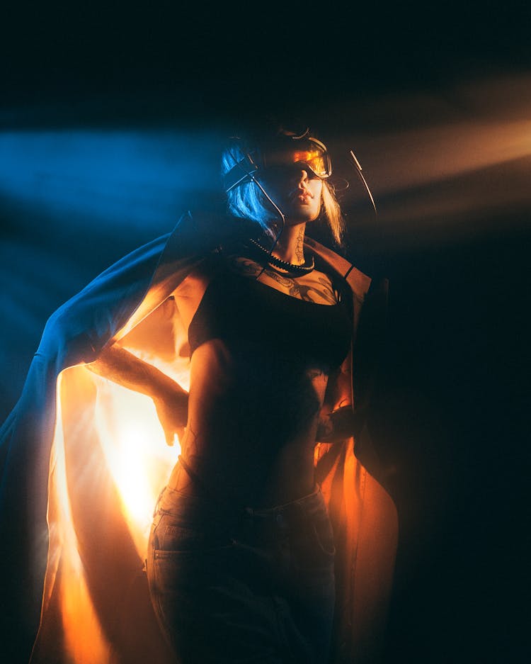 Woman Posing In Goggles At Night