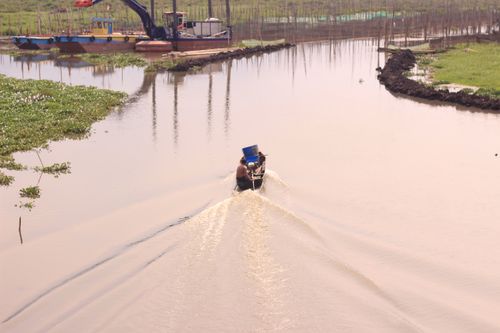 Free Past the coffee milk lake with a small boat Stock Photo