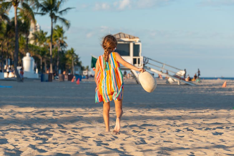 A Girl Walking On The Beach