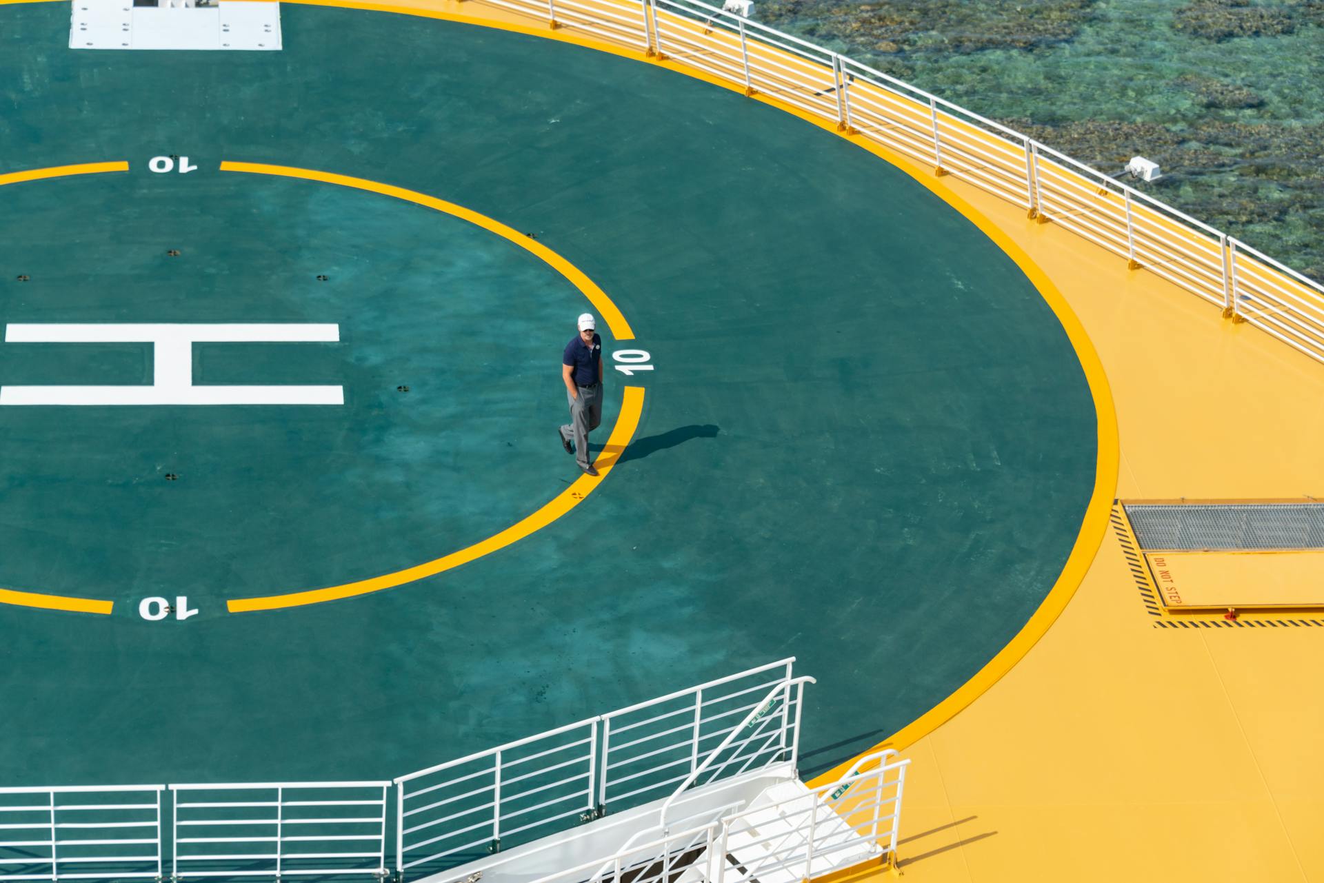 Man Walking on a Helipad 