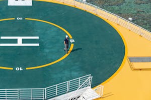 Man Walking on a Helipad 