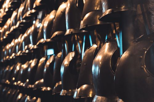 Free A collection of medieval knight helmets on display in a London museum, showcasing historical armor. Stock Photo