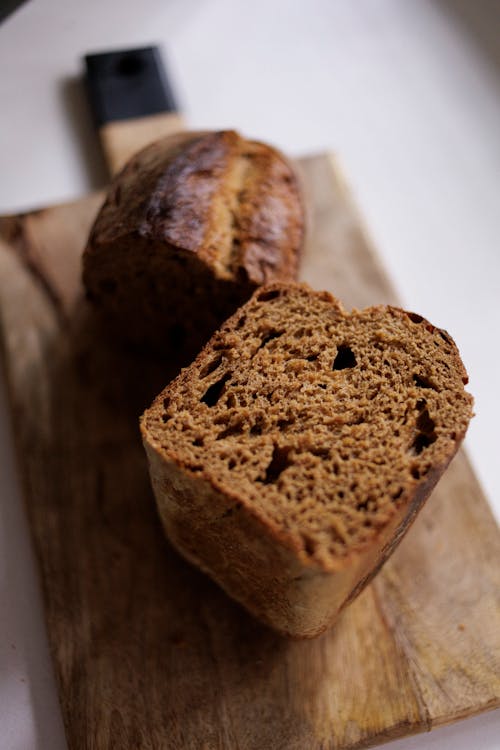 Free A Sliced Bread on a Wooden Chopping Board Stock Photo