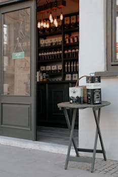 Inviting coffee shop entrance with an outdoor table showcasing coffee packages, warm and welcoming atmosphere.