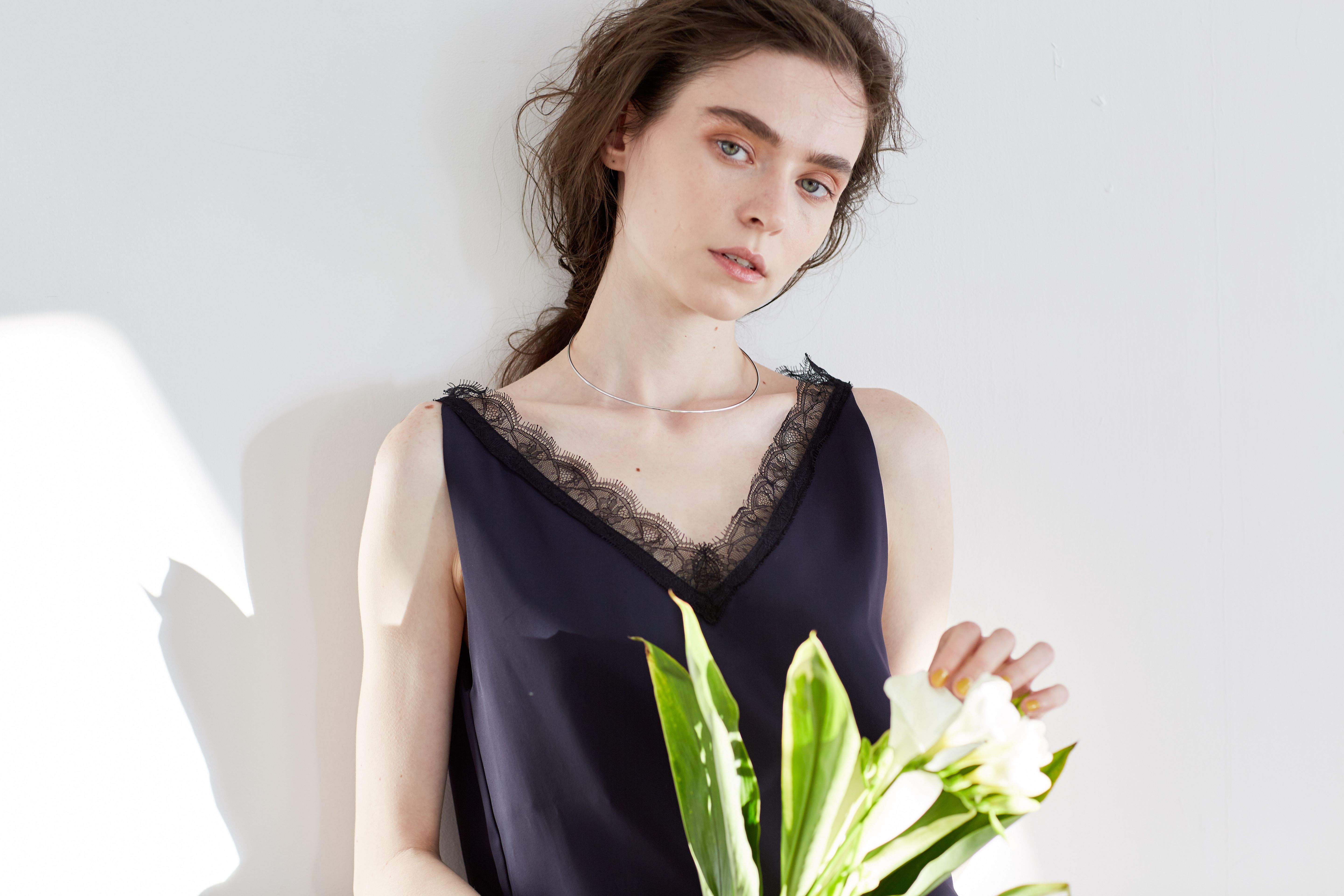 Portrait of a Beautiful Woman with a Bouquet of Flowers · Free Stock Photo