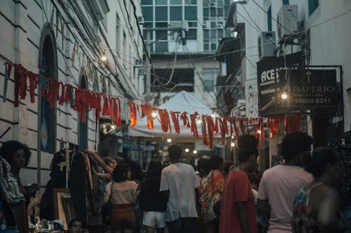 A Crowd on a City Street in the Evening 