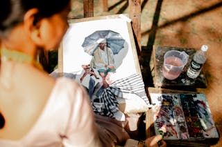 Woman Painting in the Street