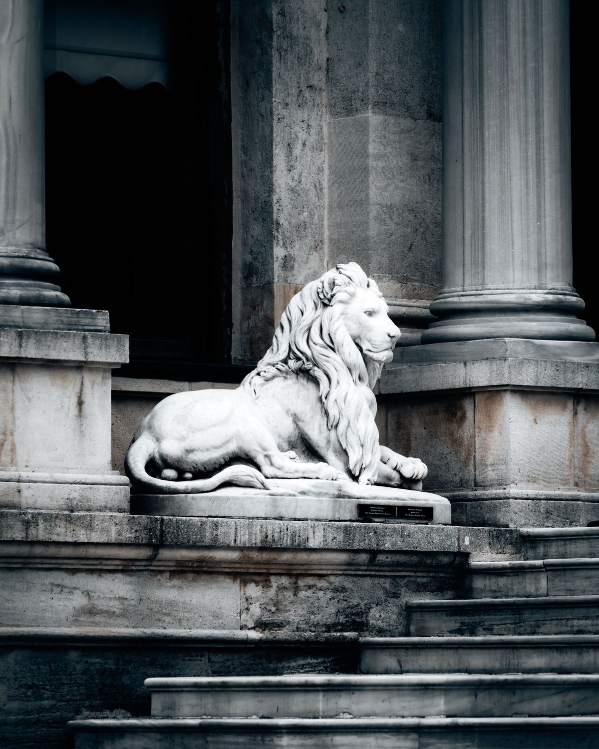 Nemean Capital — Guardian lion at classical entrance