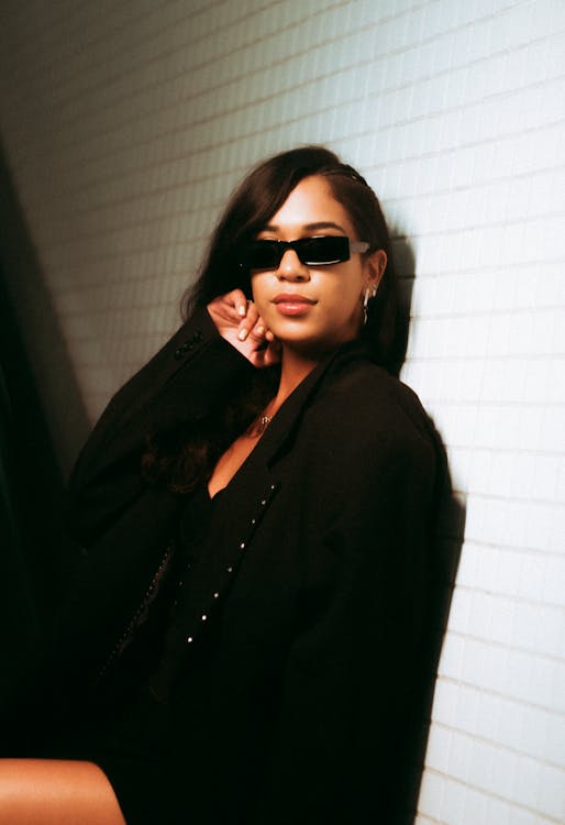 Woman Posing in Black Jacket and Sunglasses