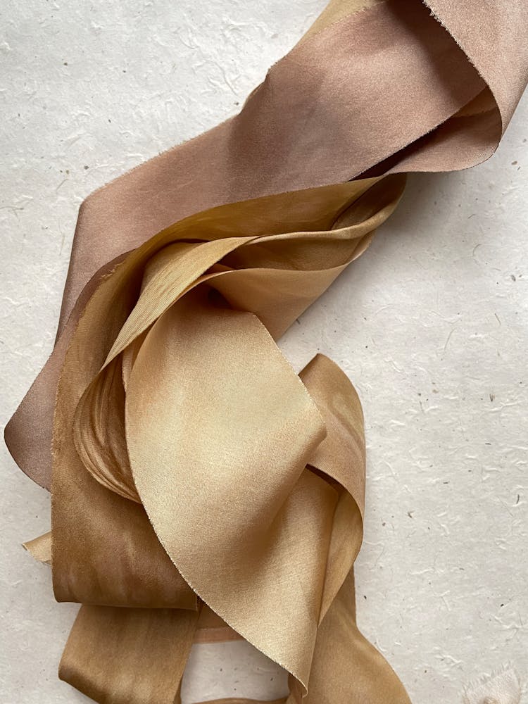 Gold Satin Fabric In Close-up Photography