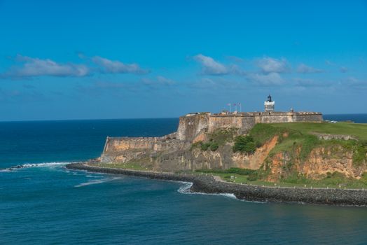Explore the majestic El Morro fortress set against a vibrant blue ocean in Puerto Rico.