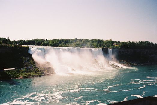 Stunning daytime photo of Niagara Falls, capturing the majestic waterfall and the surrounding natural beauty.