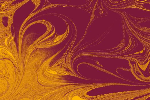 Vibrant maroon and yellow swirling marble texture, perfect for artistic backgrounds.