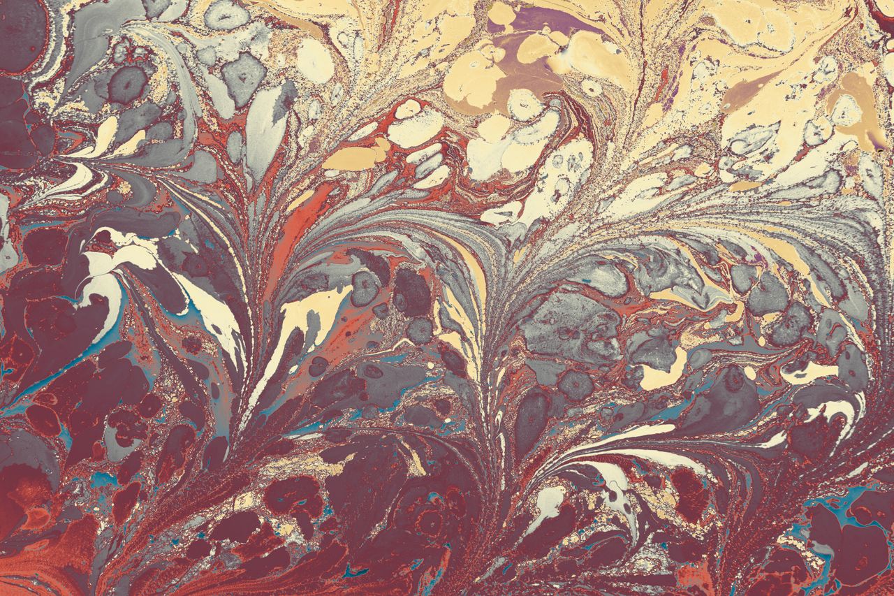 colorful abstract marbled pattern with flowing shapes and rich texture