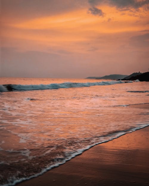 Scenic View of Sea and Beach at Dusk 