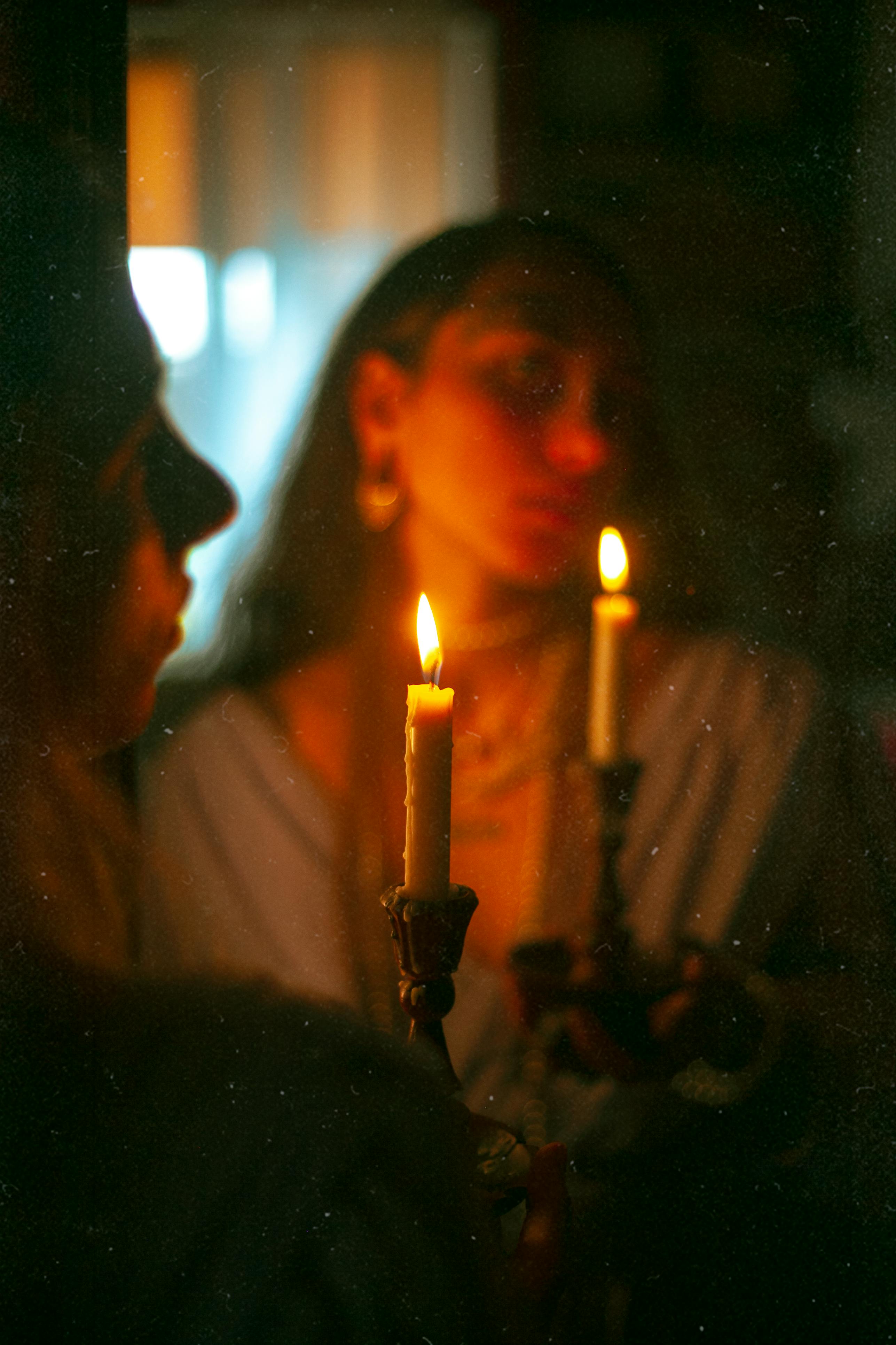 DIY wax candle making process. Woman lights decorative wax candle, close-up  of hands - Stock Image - Everypixel