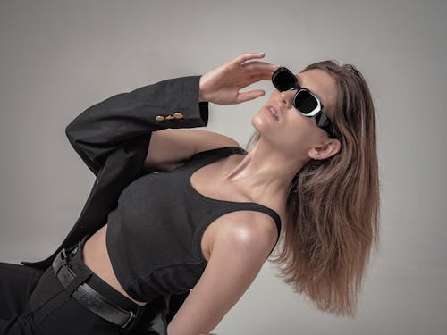 Woman with Sunglasses Posing in Black Clothes