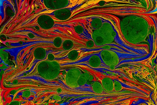 Vibrant marbling art with swirling patterns, bubbles, and bold colors.