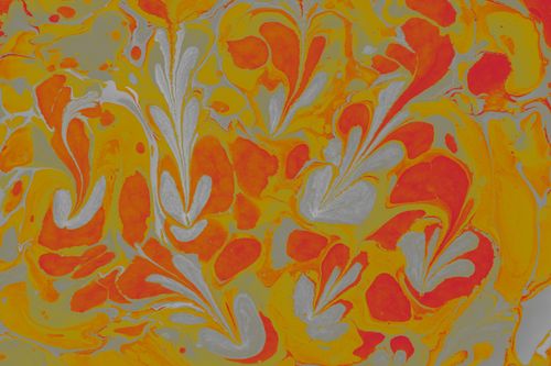 Free Colorful abstract marbled design with swirling orange and yellow hues. Stock Photo