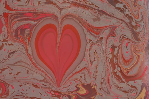 Close-up of an Abstract Painting with a Heart Shape in the Middle 