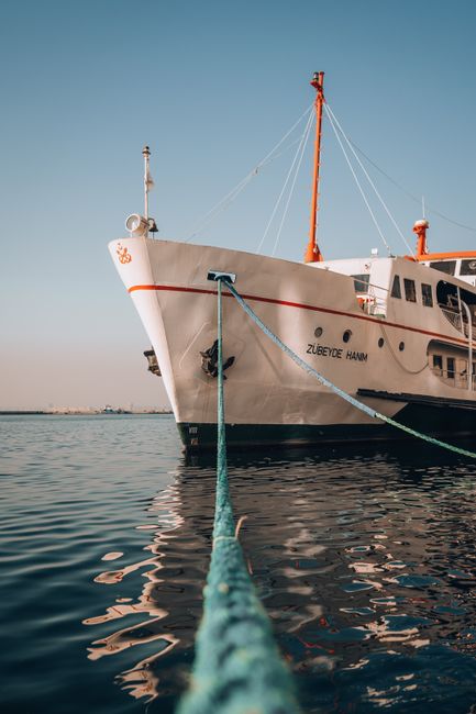 A vessel named Zubeyde Hanim moored on a calm sea with clear sky.