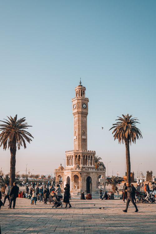 Free Captured at day, the İzmir Clock Tower stands amidst lively urban scenery in Türkiye. Stock Photo