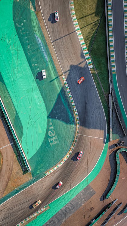 Top View Photo of Cars racing on Race Track · Free Stock Photo