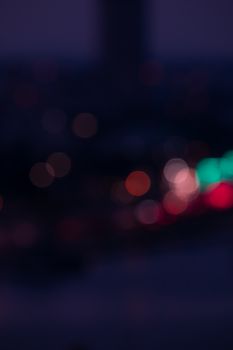 A beautiful display of multicolored bokeh lights during twilight in İzmir, Türkiye.