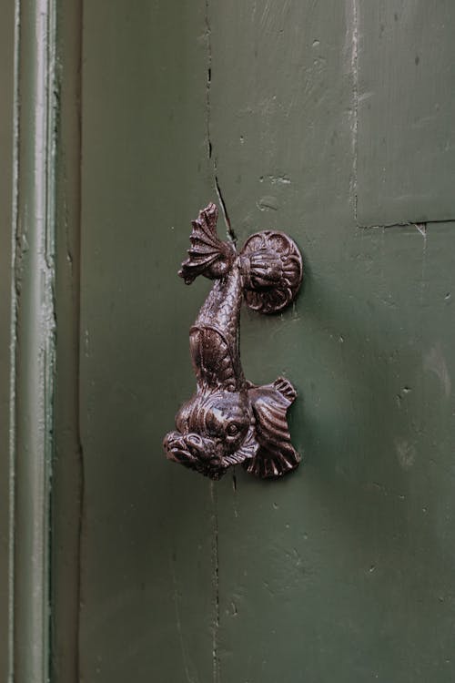 Decorated, Bronze Handle on Wall