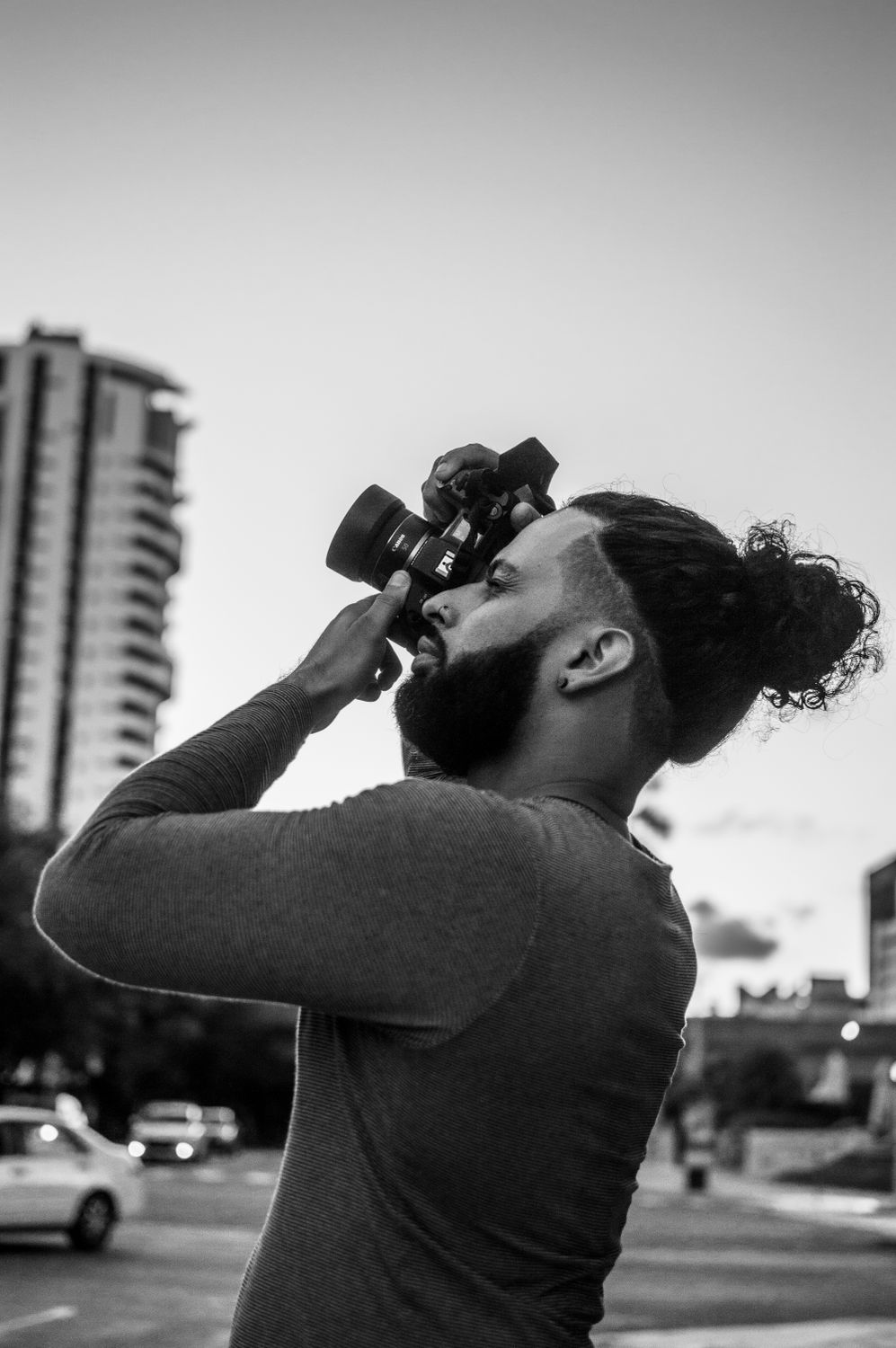 Grayscale Photo of a Man Taking a Picture · Free Stock Photo