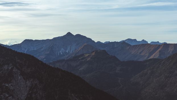 Peaceful mountain landscape with serene skies in the background.