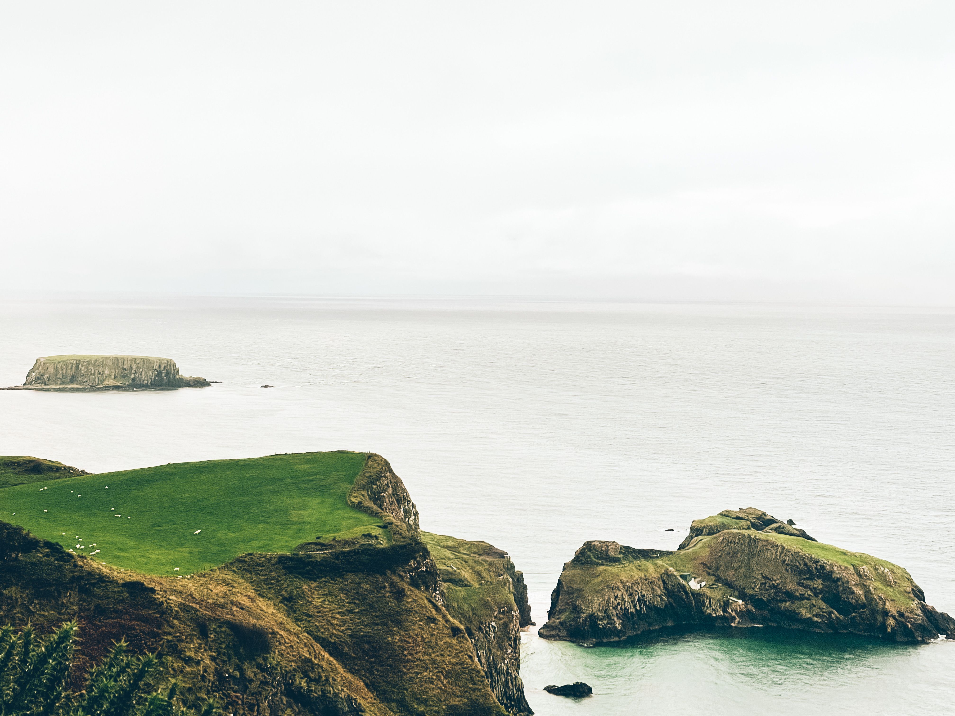 Stunning coastal cliffs and serene ocean view in Ballycastle, Northern Ireland.