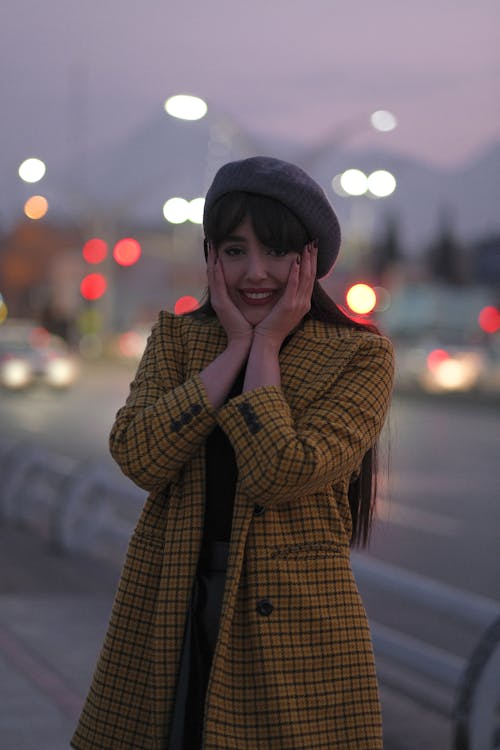 A Woman Wearing a Yellow Plaid Coat