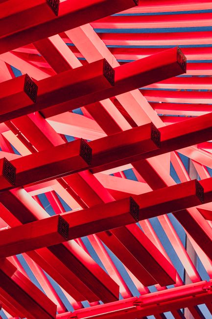 Striking red beams in geometric pattern from the China Pavilion at Expo 2010.