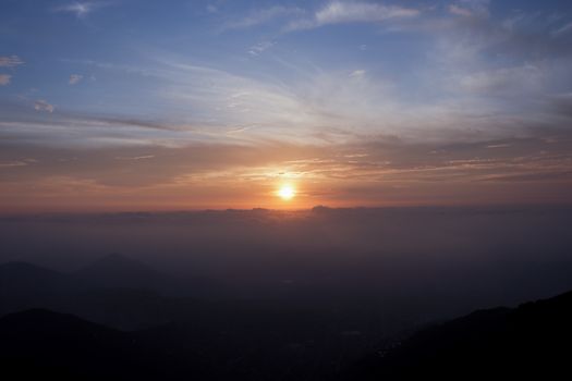 Captivating sunset over Lima, Peru with dramatic clouds and vibrant hues.